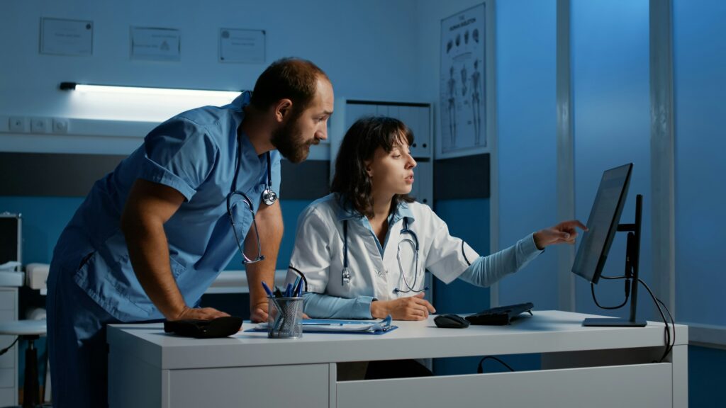 Doctors looking at a computer